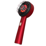 A red handheld scalp massage device with black bristles and a glowing red light therapy panel, shown against a plain white background.